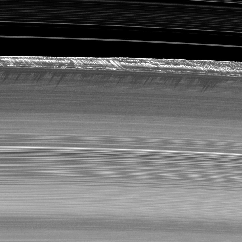 Saturnās āpeaksā on the outer edge of ring B.